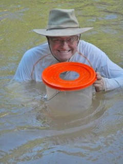 Michael with bucket in Madre de Dios, Peru.jpeg